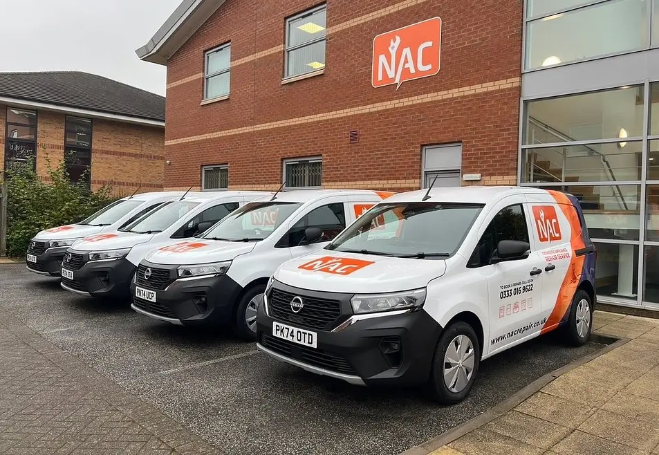 NAC's branded engineer van fleet parked outside the head office